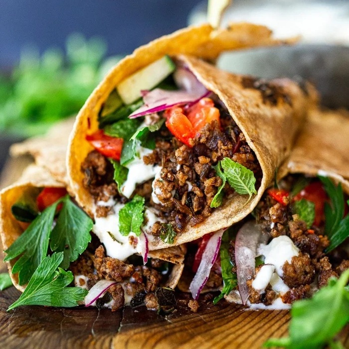 Hot cumin lamb wrap with crunchy slaw & spicy mayo
